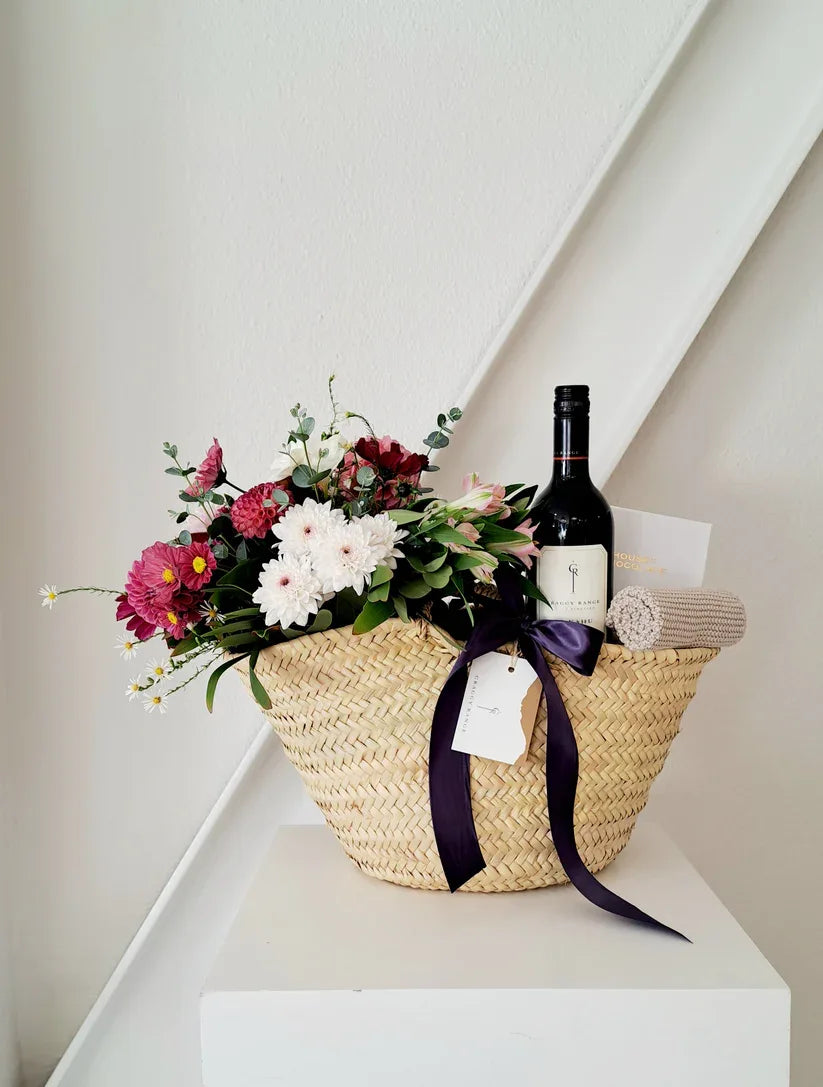 Mother’s Day gift basket with Craggy Range wine, chocolates, and blooms.