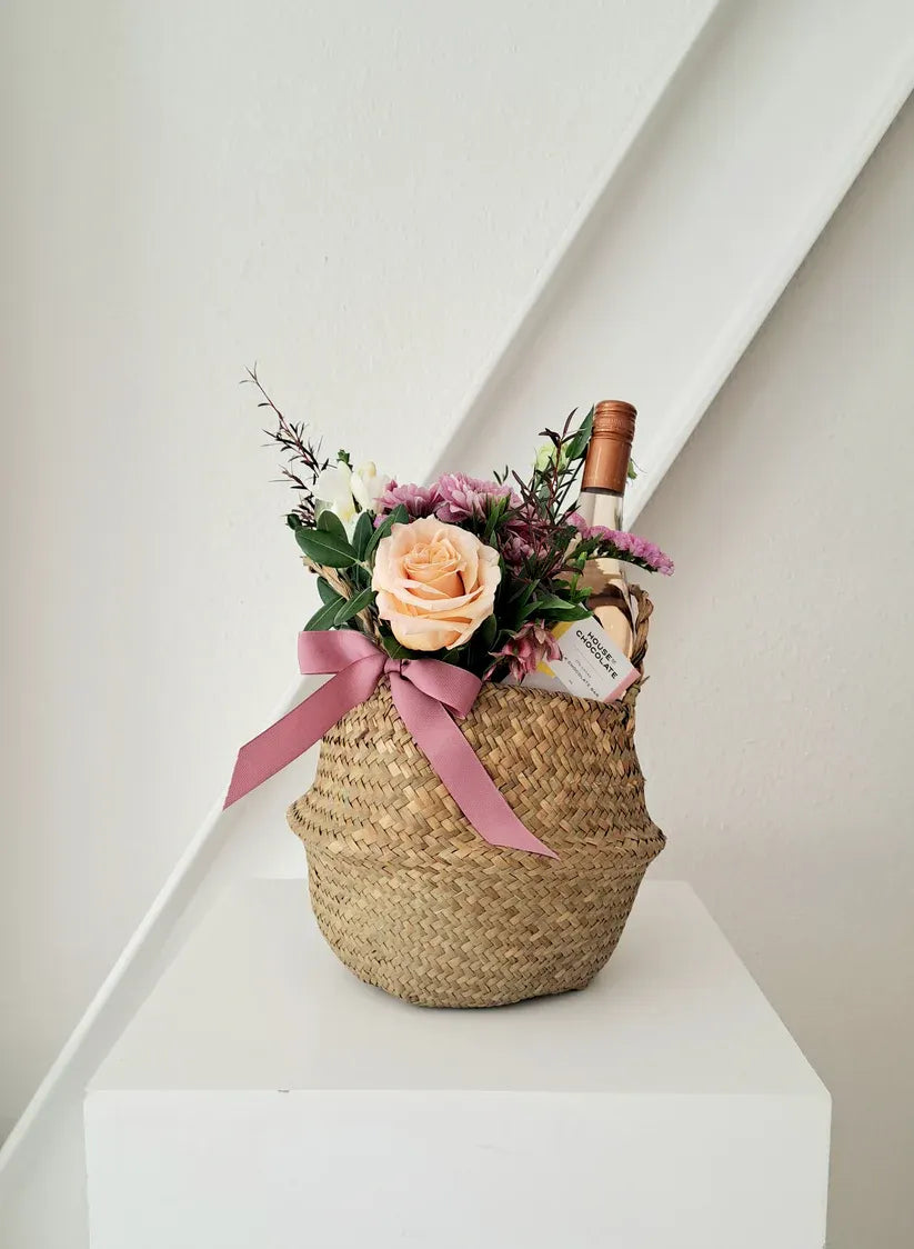 Mother's Day round basket with Craggy Range rosé, chocolates, and blooms.