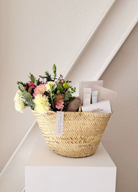 Bundle + Blooms Gift Basket featuring premium treats, gourmet snacks, and luxury pamper items for any occasion.