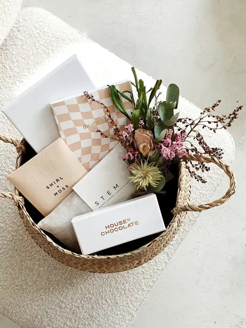 Spoil Her Gift Basket with chocolates, eye pillow, and dried flowers.