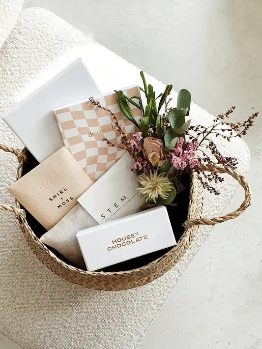 Spoil Her Gift Basket with chocolates, eye pillow, and dried flowers.