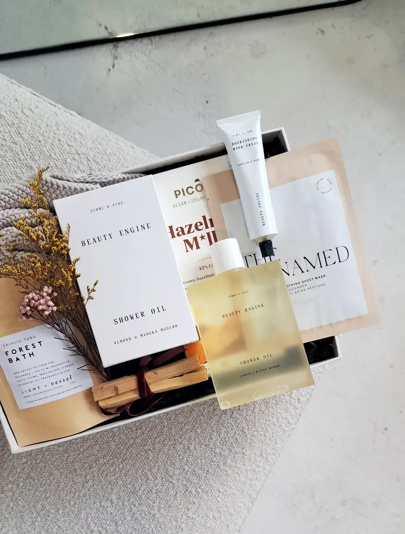 Relax & Renew gift box featuring calming skincare products, face mask, and spa essentials from Bundle + Blooms.