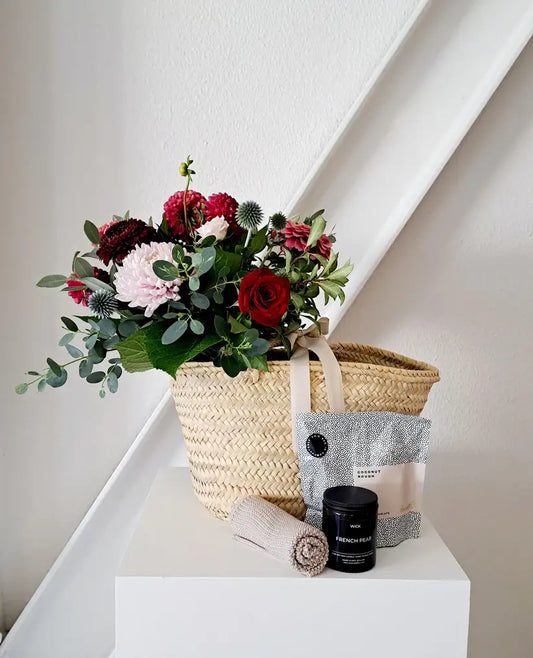 Valentine's Day Gift Basket with fresh blooms, rosé, and chocolate.