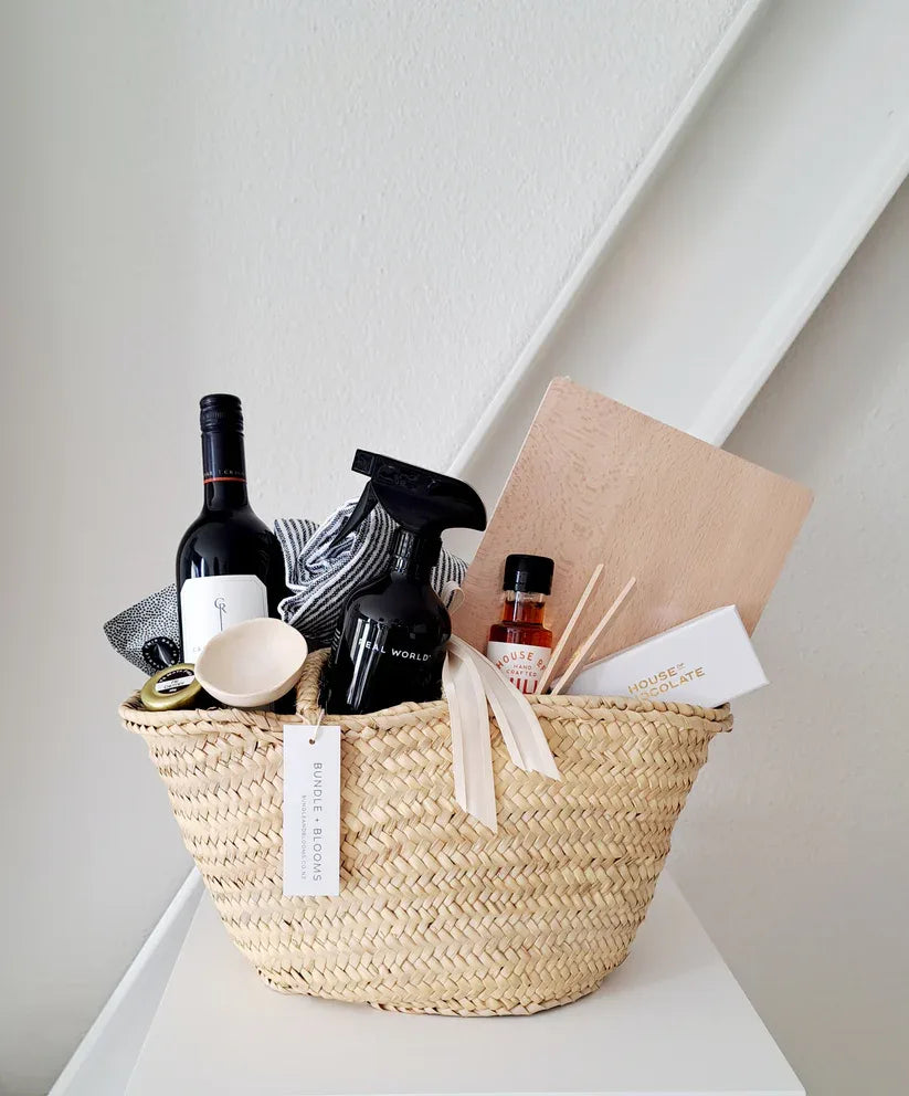 Welcome Home Gift Basket filled with gourmet treats and kitchen essentials for celebrating a new home.